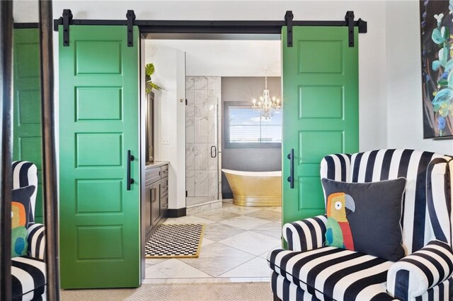 full bath featuring a chandelier, vanity, baseboards, a soaking tub, and a stall shower