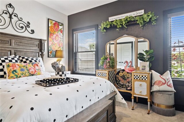 bedroom with light carpet