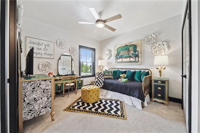 carpeted bedroom featuring a ceiling fan