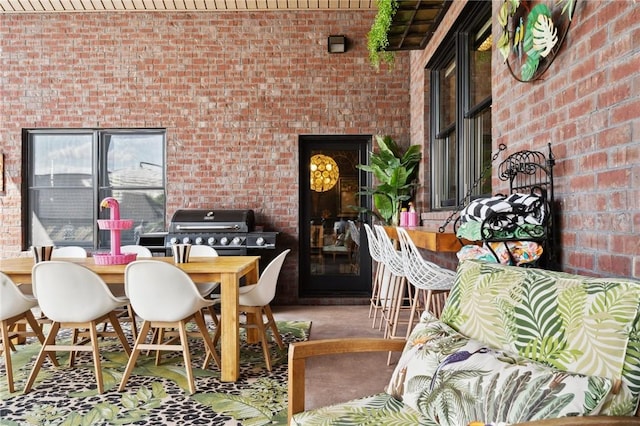 interior space featuring outdoor dining area and grilling area