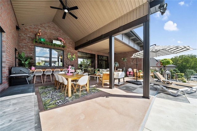 view of patio with a ceiling fan, outdoor dining area, an outdoor living space, and area for grilling