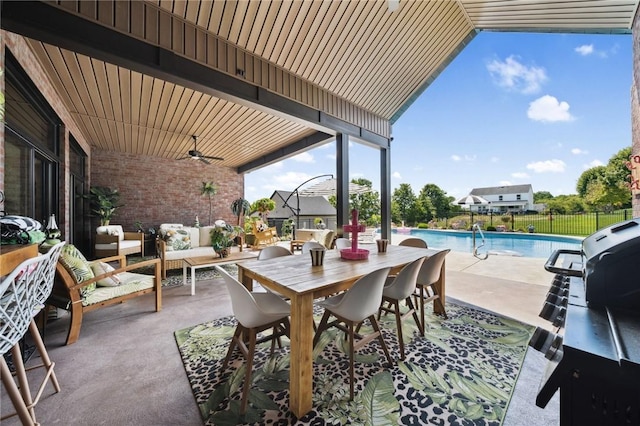 view of patio featuring a ceiling fan, a fenced in pool, fence, outdoor dining area, and an outdoor living space