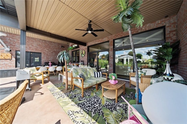 view of patio / terrace with an outdoor living space and a ceiling fan