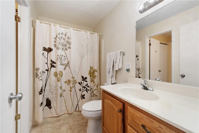 bathroom featuring toilet and vanity