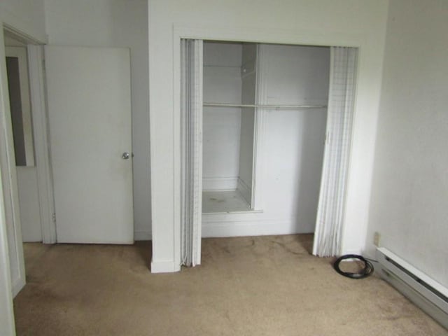 closet with a baseboard radiator
