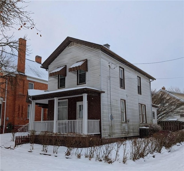 view of front of home featuring a porch and cooling unit