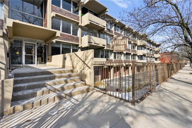 view of property with fence