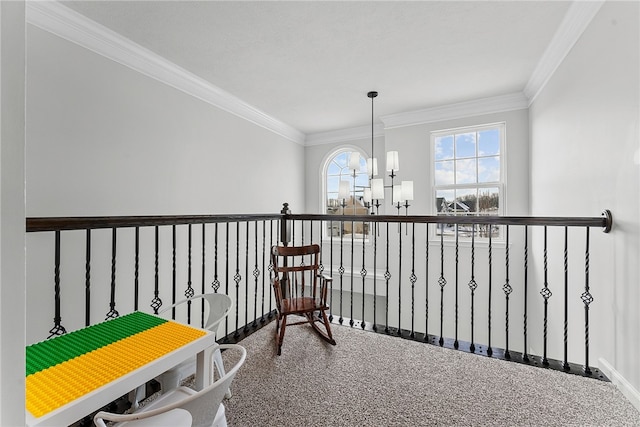 living area featuring ornamental molding and a notable chandelier