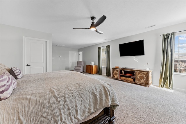 bedroom featuring ceiling fan, carpet floors, and visible vents