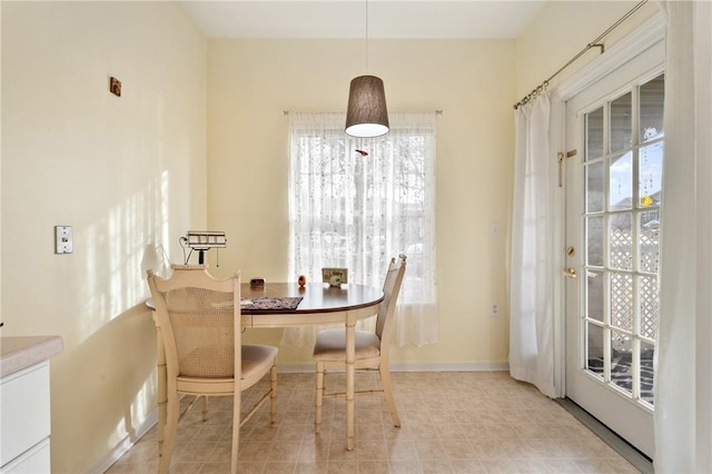 dining area featuring baseboards