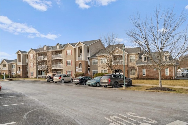 view of property with uncovered parking