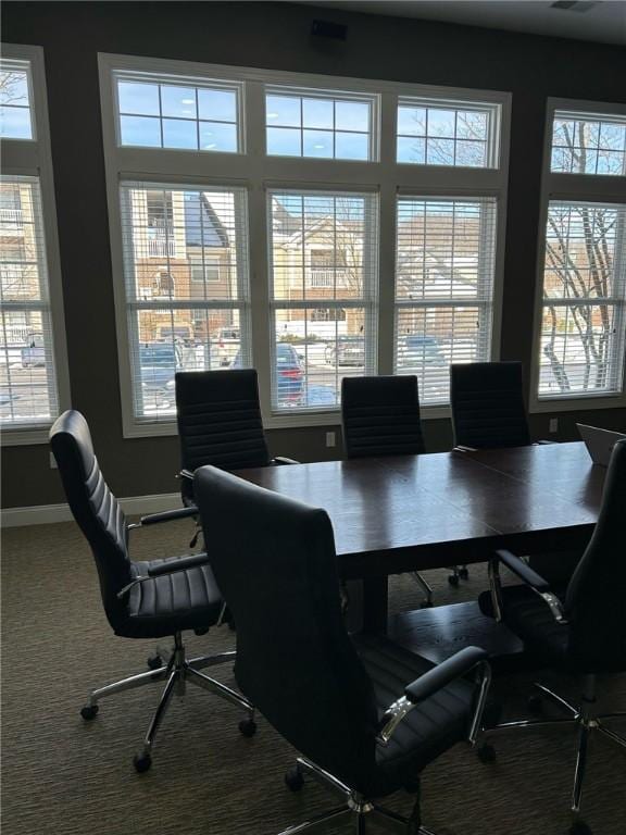 carpeted office space with baseboards