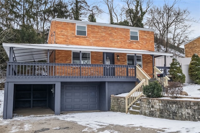 view of front of property featuring brick siding and an attached garage