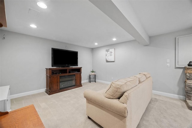 living area featuring baseboards, recessed lighting, and light colored carpet