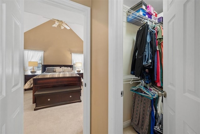 bedroom with light carpet and vaulted ceiling