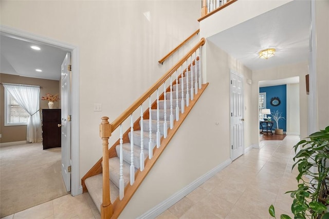 stairway featuring carpet floors, recessed lighting, and baseboards