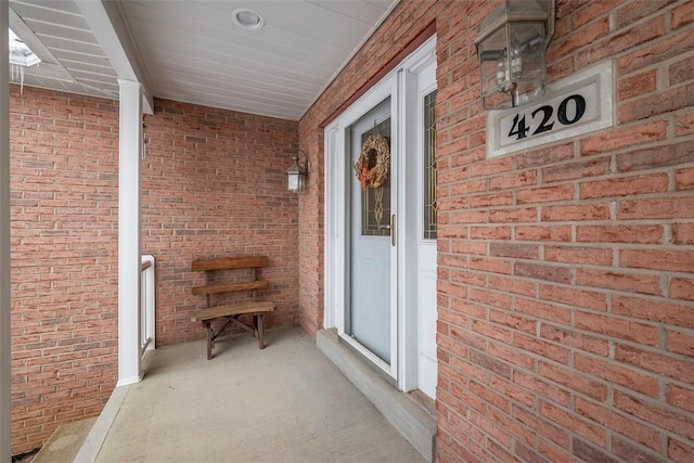 entrance to property with brick siding