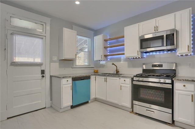 kitchen with stainless steel appliances and white cabinetry