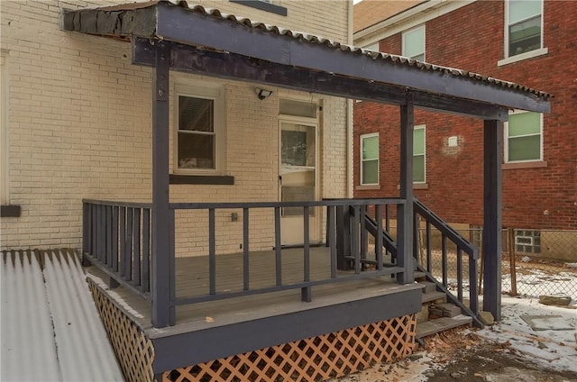 doorway to property featuring brick siding