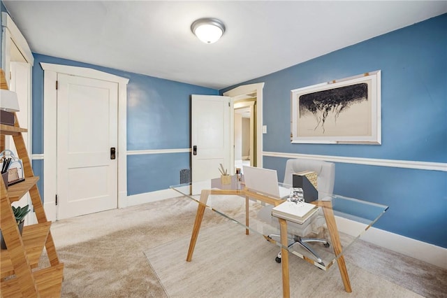 carpeted home office featuring baseboards and visible vents