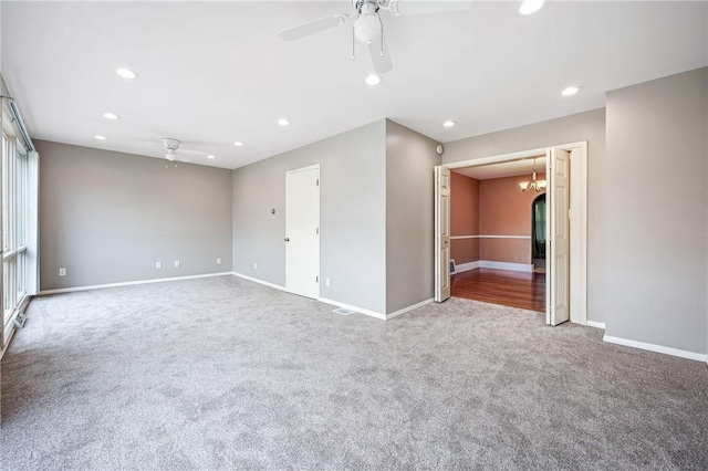 unfurnished room with carpet floors, ceiling fan, baseboards, and recessed lighting