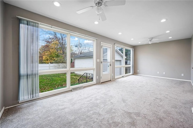 spare room featuring recessed lighting, visible vents, a ceiling fan, carpet flooring, and baseboards