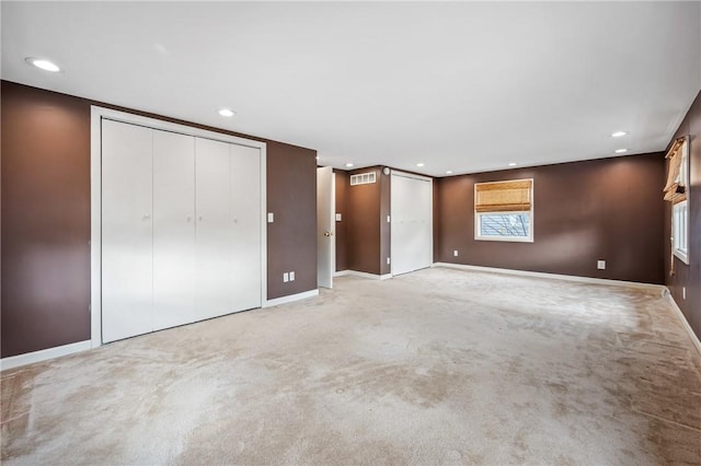 unfurnished bedroom featuring carpet flooring, visible vents, and recessed lighting