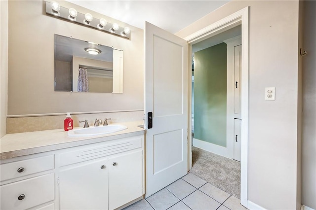 bathroom featuring tile patterned flooring and vanity