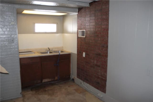 interior space with light countertops, a sink, and visible vents