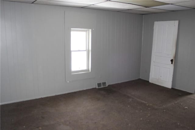 spare room with visible vents and a drop ceiling