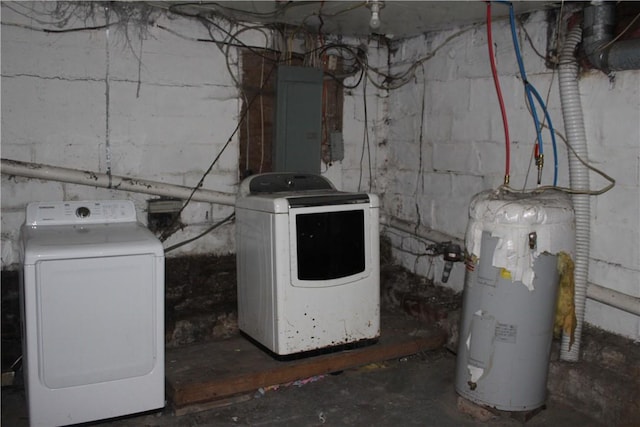 laundry room featuring electric panel, laundry area, water heater, and independent washer and dryer