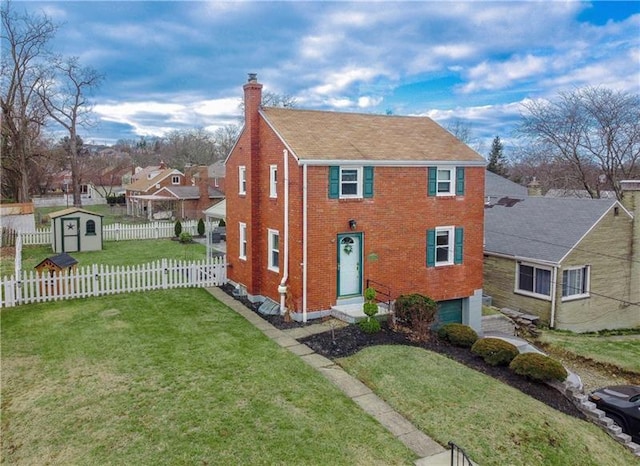 view of front of property featuring fence, a shed, a front yard, a chimney, and an outdoor structure