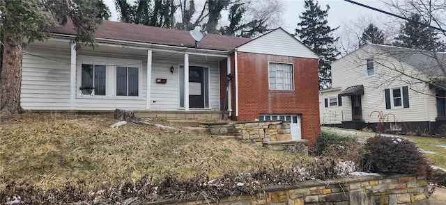 view of front of house featuring brick siding