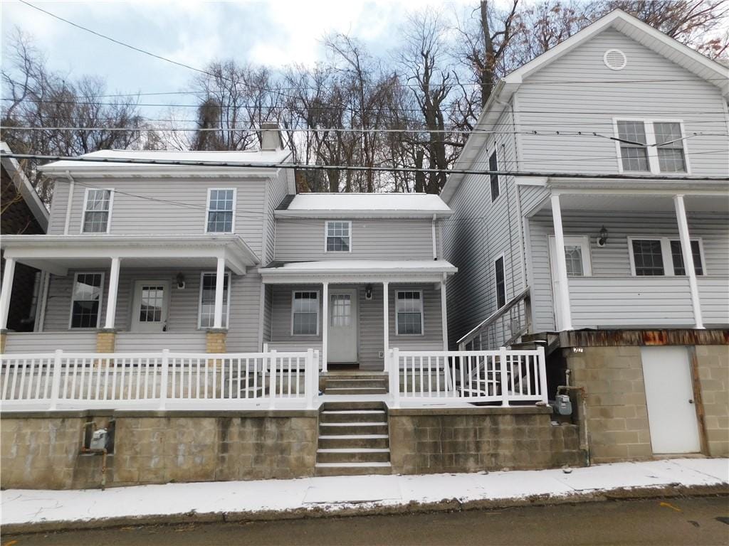 215 4th St, Fayette City, PA 15438 - view of front facade with a chimney