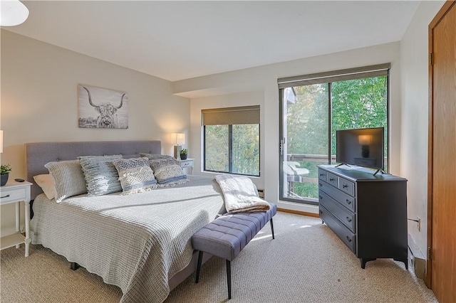 bedroom featuring light colored carpet