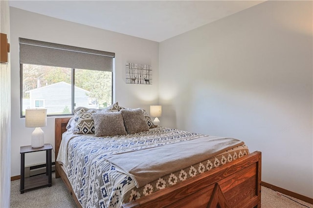 bedroom with carpet flooring and baseboards