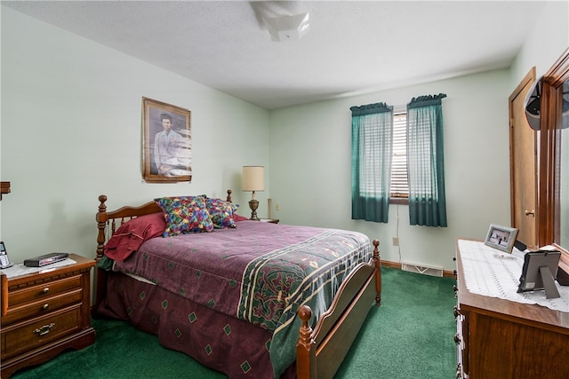 bedroom featuring dark colored carpet and visible vents
