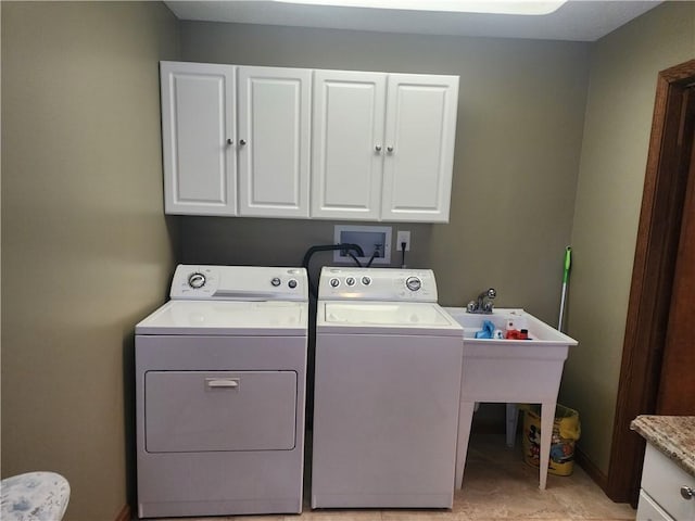 laundry area with cabinet space and independent washer and dryer