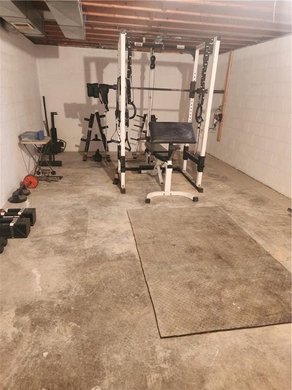 workout room with concrete block wall