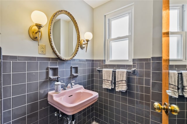 bathroom featuring a wainscoted wall and a sink