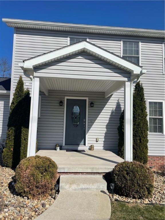 property entrance featuring covered porch