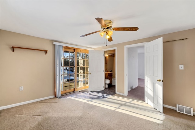 unfurnished bedroom with ceiling fan, carpet flooring, visible vents, baseboards, and access to exterior