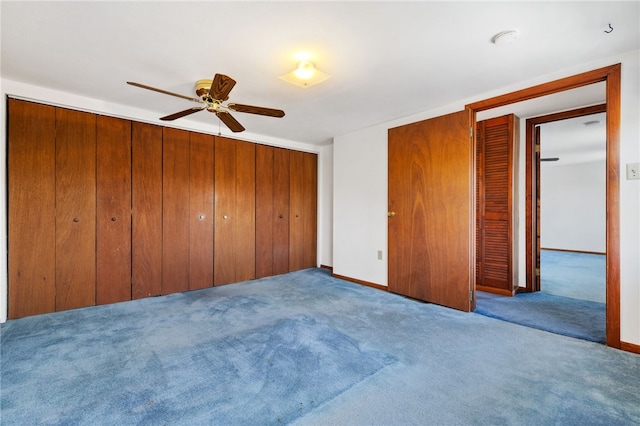 unfurnished bedroom featuring a ceiling fan, light colored carpet, and baseboards