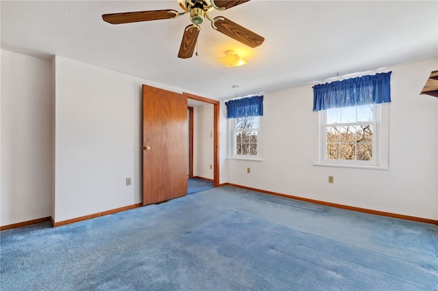 spare room with carpet flooring and baseboards