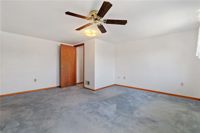 unfurnished room featuring baseboards, visible vents, and light colored carpet