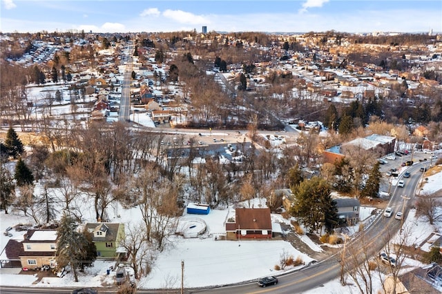 snowy aerial view featuring a residential view