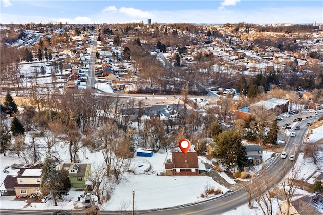 snowy aerial view featuring a residential view