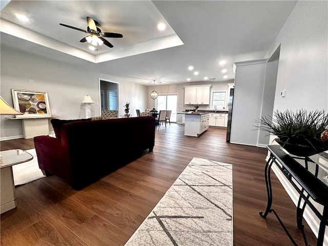 211 Ruby Dr, Menallen Twp, PA 15401 - living area with ceiling fan, dark wood finished floors, a raised ceiling, baseboards, and recessed lighting