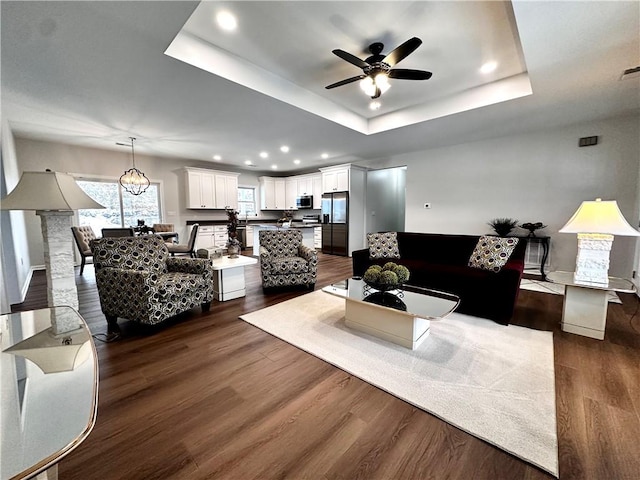 211 Ruby Dr, Menallen Twp, PA 15401 - living area with a ceiling fan, a raised ceiling, baseboards, recessed lighting, and dark wood-type flooring