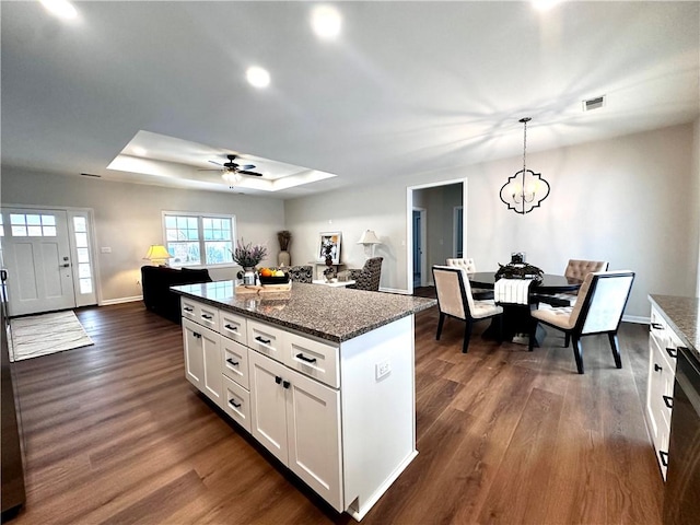 211 Ruby Dr, Menallen Twp, PA 15401 - kitchen with a raised ceiling, ceiling fan with notable chandelier, dark wood finished floors, and visible vents